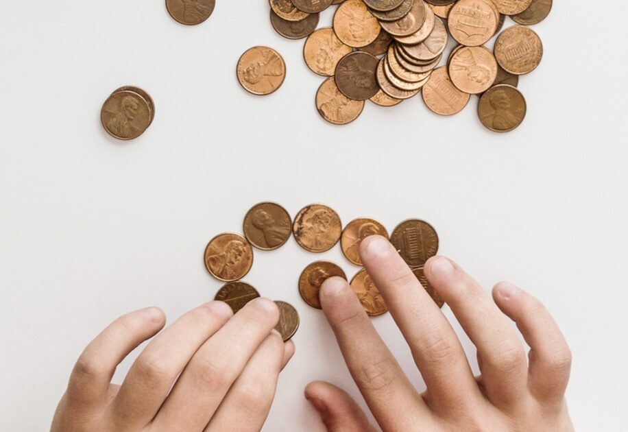 student counting pennies