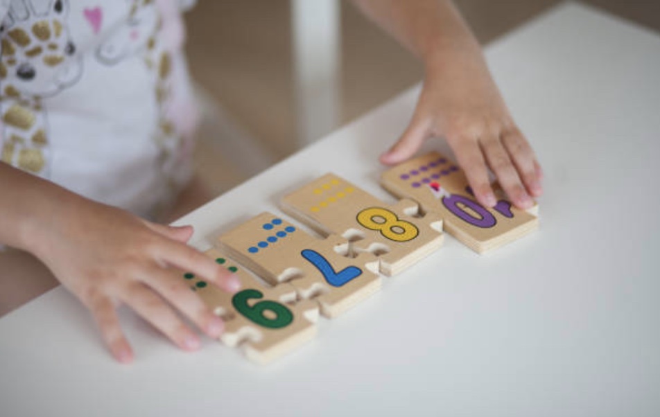 child doing a puzzle during morning work